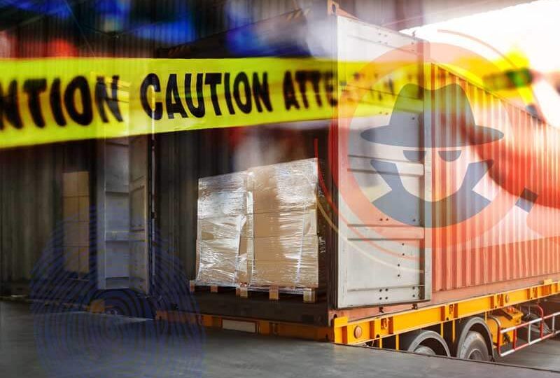 A dry van trailer backed up to a loading dock with caution tape over it